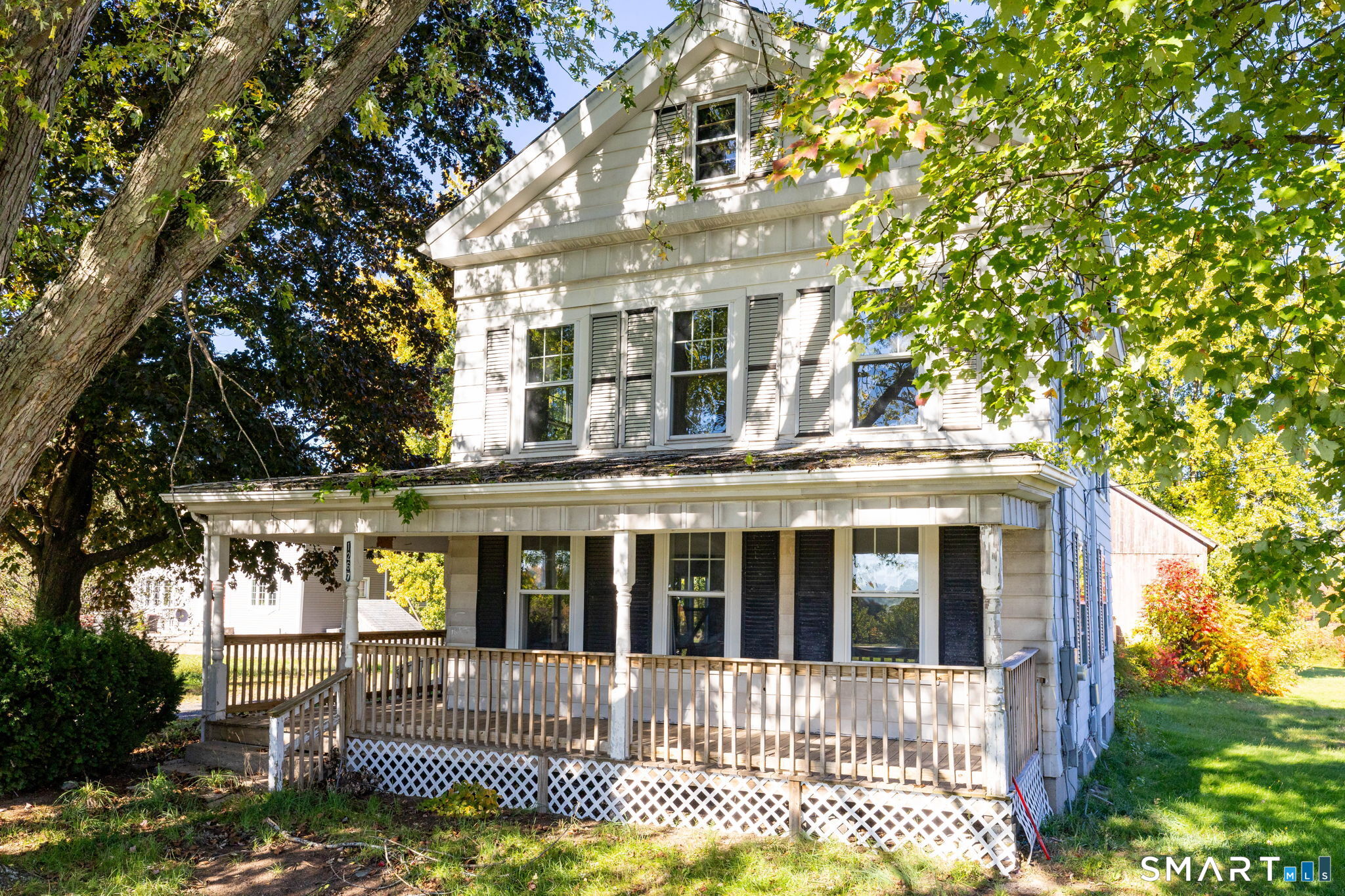 Step back in time & discover the possibilities! This charming 1850s Colonial-style farmhouse captures the timeless character of Suffield's rich history while offering a wonderful opportunity to make it your own. With a little love & personal touches, this home has the potential to beautifully blend its historic roots with modern comforts, creating something truly special. Adding another layer of opportunity, the property benefits from both residential & commercial zoning, opening the door to a variety of potential uses beyond traditional residential living, subject to town approvals. As you step inside, the warmth of the original charm is immediate, highlighted by beautiful hardwood that flows throughout the 1,882sqft of living space. The home features 5 spacious bedrooms & 2.5 bathrooms, providing plenty of room to spread out. While the character is historic-complete with a classic slate roof & full basement-central air conditioning adds a welcome modern convenience to keep things cool all summer long. The property also features a 2-car garage, offering one traditional bay and a second bay with soaring ceilings for added versatility; car enthusiasts take note! Adding to the property's charm is a barn featuring a spacious loft, beautifully complementing the farmhouse aesthetic while offering versatile space for storage, vehicles, & equipment. Set on a sprawling 1.12-acre lot, this property offers a rare blend of historic charm, versatility, & endless possibilities-don't wait!