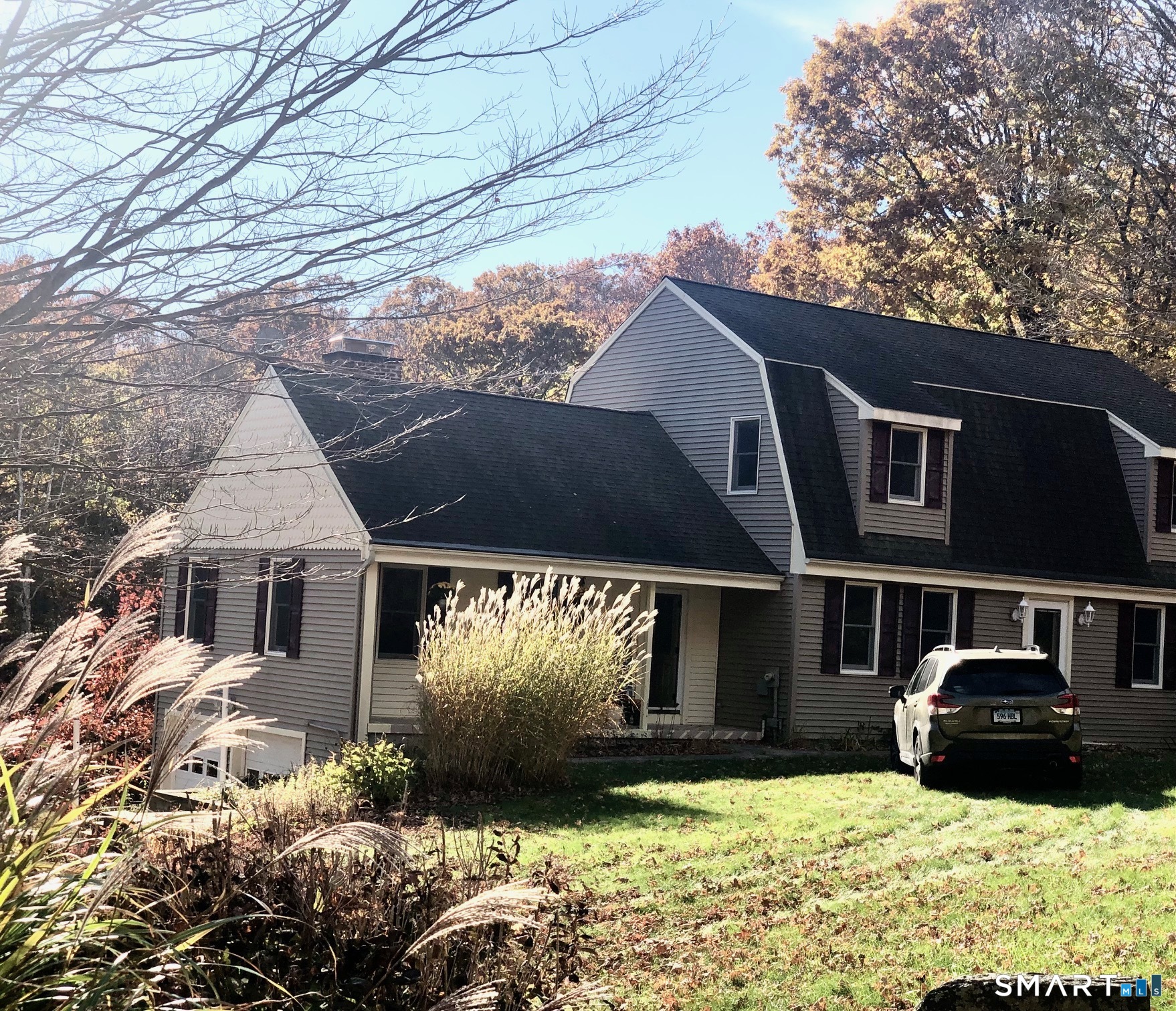 Country living in this stunning 3-bedroom, 3.5-bathroom gambrel colonial on a Barkhamsted cul-de-sac. This home offers multi-generational living, including an In-Law studio apartment with a separate entry, full kitchen, and bath. The great room features wide-plank flooring, a brick fireplace (ready for gas log installation), built-ins, and crown molding. The sunlit, generous-sized kitchen features granite countertops, SS appliances, tiled flooring, and an eat-in area. The main-level laundry room includes a 1/2 bath. The main front door entrance, with marble-tiled flooring, leads to the upper-level stairway and the kitchen hallway. The primary bedroom suite includes a full bath with a marble-tiled floor, a whirlpool tub, and a walk-in closet. The outdoors include a heated in-ground pool in a fenced-in area. Perennial gardens, blueberry bushes, and fruit trees surround the property. Just minutes away, enjoy year-round recreation for all ages: hiking, fishing, and skiing at nearby Ski Sundown, plus local breweries and dining. Bradley Airport: approx. 25 min. away.