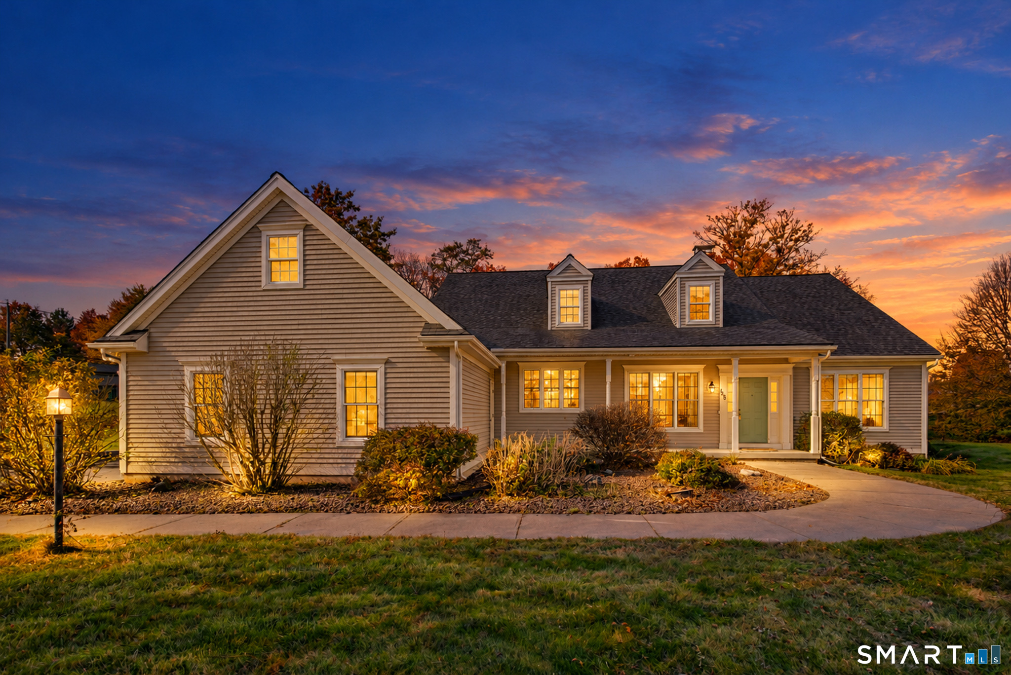 An Exceptional Home with Incredible Multi-Generational Potential. This spectacular English-style Cape offers 3,852 square feet of above-grade living space, 5 bedrooms and 3.5 baths, set on a beautiful 1 acre lot in a desirable cul-de-sac neighborhood. With Ash hardwood flooring, soaring ceilings, wainscoting, expansive living spaces, and an abundance of natural light, this home offers a remarkable combination of space and versatility.The eat-in kitchen features granite countertops, custom wood cabinetry, and an oversized window bringing in beautiful natural light. A formal dining room sits just off the kitchen creating perfect flow when entertaining. The spacious living room features a wood-burning fireplace and access to the Trex deck, featuring picturesque farmland views. The first floor features three bedrooms, including a spacious primary suite with a Jacuzzi tub and separate walk-in shower. Upstairs, discover a versatile second-floor living space featuring its own kitchenette with room for dining, a separate living area, and two additional bedrooms. This arrangement offers outstanding potential for multi-generational living or extended guests.The basement is partially finished with drywall and offers additional potential for expansion, there is room for everything your heart desires, and then some.With its impressive size, flexible floor plan, beautiful architectural details, abundant storage, natural light, and stunning farmland views, this is a truly special property.