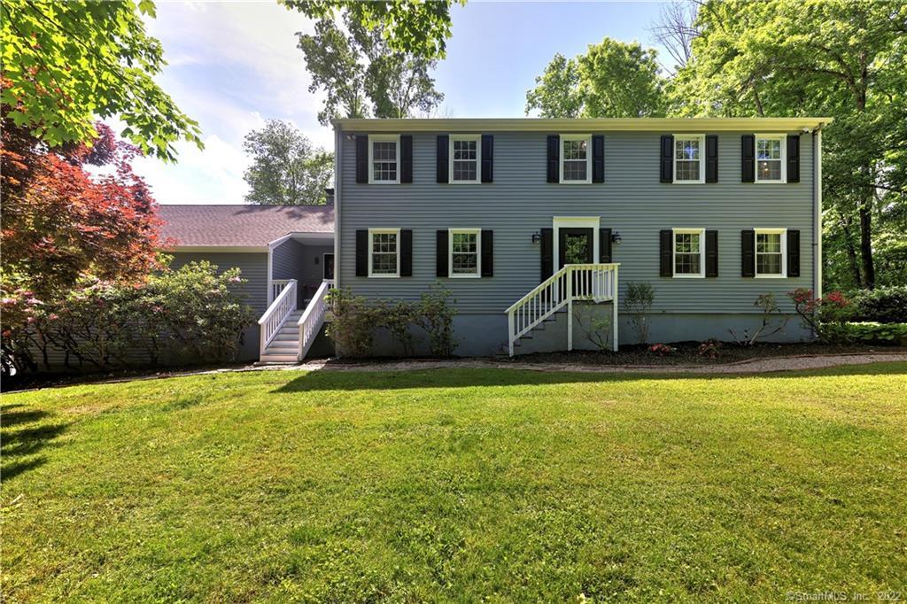 Privacy abounds in this charming Gentleman's Farm. Welcome home to 511 Weekeepeemee Rd in the lovely town of Woodbury, CT. This sprawling farmhouse colonial is nestled on 12+ private acres. If space is what you desire this home will not disappoint. Walking into the front entry you are greeted by solid hardwood floors which flow throughout the main level where you will find every room to be oversized. The kitchen is complete with wood cabinets, granite countertops, and stainless steel appliances, and is open to a family room with the most impressive stone fireplace. The formal dining room is adjacent to the formal living room giving you great space to gather with family and friends. Those that love to entertain will be thrilled to find a massive great room with a wood-burning stove over the garage which will make the perfect place for your next party! Upstairs you will find a large primary suite complete with changing area and full bath. This level also has 3 additional oversized bedrooms and a full bath! Outside you can relax on a freshly painted deck overlooking your backyard with plenty of perennials, a butterfly garden, and a gazebo area abutting a large hayfield perfect for watching the evening sunset. Just a short walk from the house every horse lover will be delighted to find an 8-stall barn with electricity and water, 2 paddocks, a riding ring, and even a round pen! This is a truly special home and a must-see! ** AGENT OWNER **