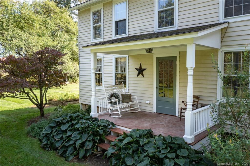 Enjoy beautiful view of Canaan Mountain from this renovated circa 1825 home with new 56x56 insulated workshop.  This 5 bedroom home sits on two nicely landscaped acres.  Many newer upgrades include septic, roof, furnace, decking, water tank, appliances and front porch. First floor bedroom can also serve as office.  A full bathroom on each floor - upstairs bathroom includes laundry hookups. Original wide board chestnut flooring. Pellet Stove in Living Room. Additional wood stove in basement.  23x22 deck facing the mountains. The large workshop was built in 2016.  This is perfect for work and play! Large area upstairs can be finished for game room/office or potential living space. Workshop is well insulated and prepped for radiant heat  All room sizes are approximate.