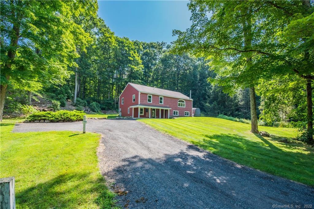 Don't miss this perfect starter home on quiet Mill Road in quaint Woodbury CT. A 2000 sq ft home with the potential for another 500 to 750 square feet in the full walkout lower level.  This impeccably maintained home provides hardwood floors throughout the main level, a kitchen/dining area with sliders that open to a ground-level deck, and a large living room with a wood stove to heat the entire house. The ground-level entryway features an open front porch, a foyer with built-ins, a third bedroom, and room for expansion in the already framed basement area. A quiet location and an even quieter backyard with an expansive lawn, garden area, and room for a barn. This energy-efficient home is cheap to heat and requires very little maintenance.