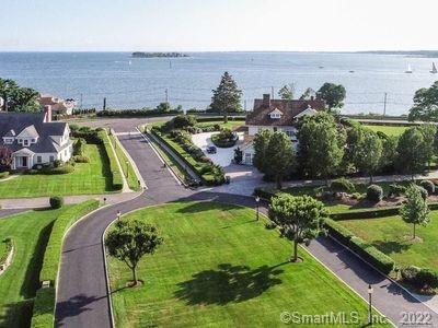 This waterfront architectural masterpiece built in 2000 is crafted with only the finest materials and is situated in front of the Long Island Sound. A half acre professionally manicured grounds leaves nothing to be desired. This Home has a Brand-New Cedar Roof installed in Late 2020 and warranted for 50 Years, many upgrades completed, A grand foyer with soaring ceilings beckons you to the most spectacular view of the Long Island Sound. The luxurious master bedroom On First Floor features a walk-in closet/dressing room, large master bath. The second floor with three additional bedrooms and 2.5 baths.  This private oasis is surrounded by lush lawns, mature trees, and a Gunite Pool and sauna, which make this a true private oasis for the most discerning buyer seeking privacy and tranquility.  The incredibly lower level consists of a home theatre and features a wine room.  This is an outstanding value, beyond all other properties, waiting for you Only 1 hour 15 mins from New York City! and only 1 Mile to the Train station. A wonderful house in a fantastic location. Wonderful detailing throughout