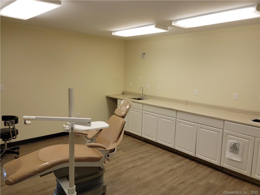 Fully built out dental office with possible upstairs apartment. Lots of amenities . Also great professional or medical office. Vaulted ceiling in the entry way . Lots of natural lighting.