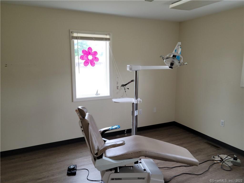 Fully built out dental office with possible upstairs apartment. Lots of amenities . Also great professional or medical office. Vaulted ceiling in the entry way . Lots of natural lighting.