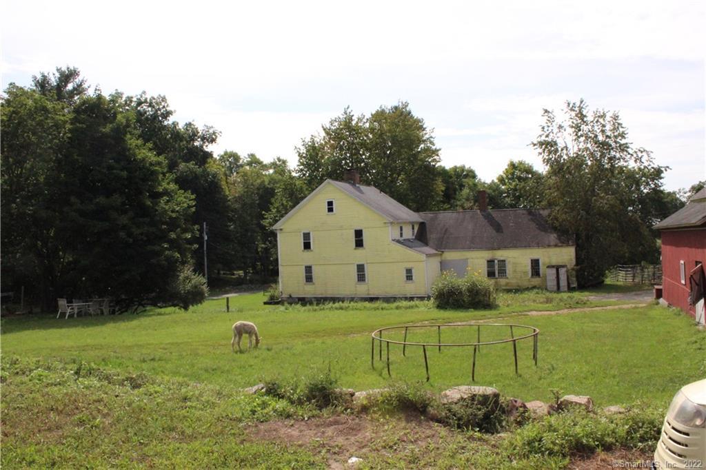 Unique opportunity to own approximately 87 acres with an Antique home with barns, stalls and riding ring, in need of tlc. There are four lots that make up the 87 acres One lot in Bethlehem and Three in Woodbury. Lot 1- 7.00 acres Located in Bethlehem, Ct. Lot 2 - 7.22 acres. Lot 3 with house and barns is -11.59 Acres and Lot 4 with 61.76 acres. Sold all together will not divide. Property is currently an operating horse boarding facility. Main Barn with a 60 x 120 indoor riding ring plus 20 stalls. Feed room and tack room. Offices on the second floor. Two additional post and beam barns with stalls and loads of storage space and potential. Outdoor riding ring. The 1795 Colonial needs to be completely redone. It's down to the studs and awaiting to be remodeled. Overall this property offers loads of possibilities.