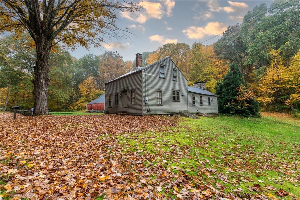 HISTORIC HOME This Home is in excellent condition for it's age. Spacious Family Room with huge fireplace with built in oven for baking. The Family Room also has propane stove for heat. The home offers four additional rooms, Living Room, Formal Dining Room and Kitchen on first floor and Master suit on the second floor. The Property has two Barns, both with separate power source.