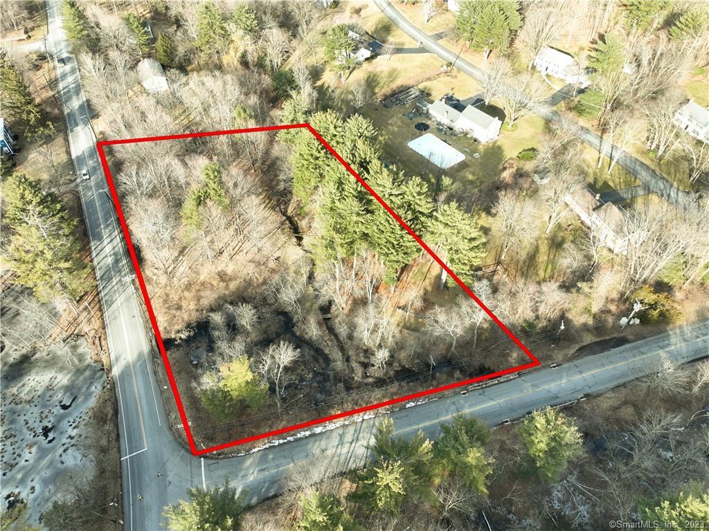 Great opportunity to own or build on a large 2 acre corner lot. There is a lateral sewer line on Bushy Hill. Connection required.