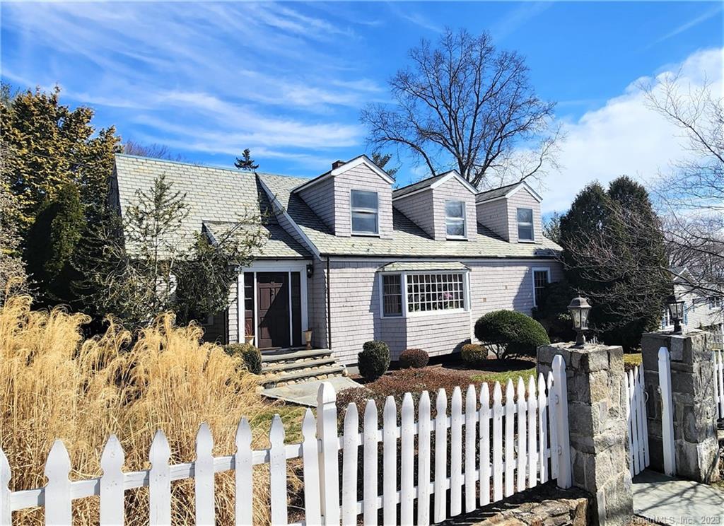 Beyond the front door of this charming Cape Cod colonial with a grand stone pillar entrance, elegant slate roof & towering trees are more spaces and special features than you can imagine. Well-located in the desirable town of Fairfield with beach rights, great shops & restaurants, and train station to NYC, this home has an incredibly flexible floorplan offering many options. Handsome Brazilian cherry hardwood floors throughout. Formal spaces include the living room with woodburning fireplace & large picture window, and a spacious dining room for those special dinners. The fabulous eat-in kitchen has a unique glass atrium, center island with seating for three and door to a large deck. There is a den for cozy relaxation. A tremendous bonus room can also serve as a 1st floor primary bedroom, as there is a closet & full bath. Or use the office with separate exterior entrance & powder room as the 5th bedroom. The 2nd level primary bedroom is king-sized with two entry doors and a walk-in closet. There are 3 more bedrooms on this level and a full bath with separate tub & shower. Use the sitting area as a workstation or lounge space. The lower level has another woodburning fireplace and room for pool table, exercise equipment and more. There is also a full bath with shower & a very functional laundry room with sink. Outdoors, enjoy two spacious lawn areas, a large deck & stone patio. Two-car garage plus plenty of room for additional cars, Central A/C on 2nd level. Great opportunity!