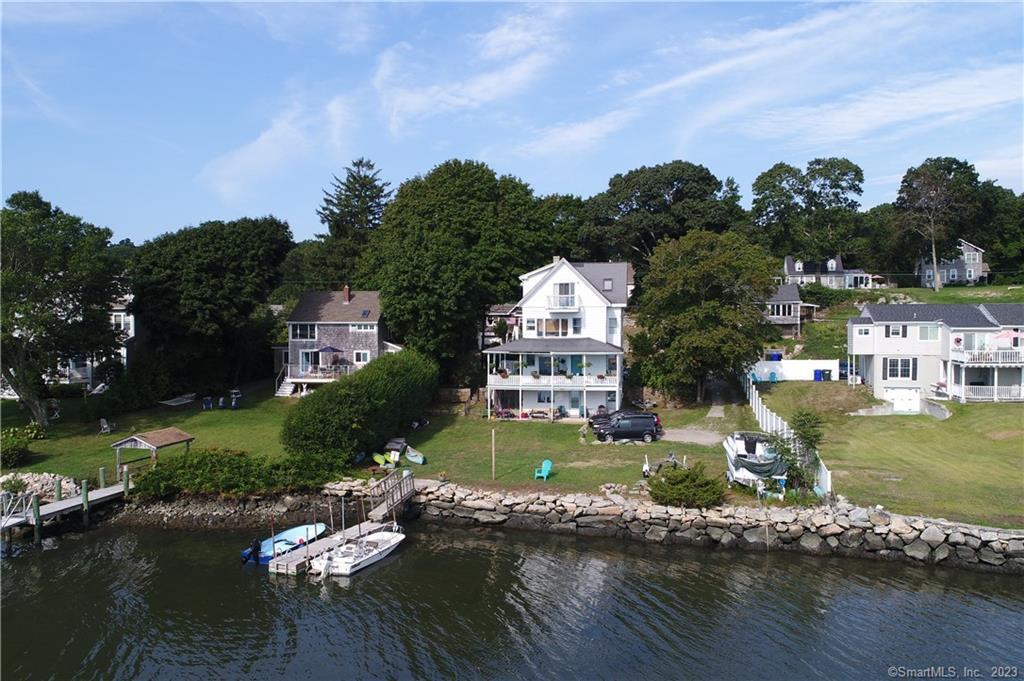 Unique opportunity to own Waterfront property with investment potential in the historic district of Noank! This multi-family home is minutes away from downtown Mystic and within walking distance to the charming seaside village of Noank. All of the units have beautiful water views. Three of the units have panoramic views of Masons Island, Fishers Island Sound and the Mystic River. There are a total of 15 rooms of which include 6 bedrooms, 6 full and 1 half baths, and a kitchen in each unit. Work remotely from home while enjoying the water views. After a long day, take a relaxing swim or kayak out to the water to unwind just steps from your backdoor. Noank is situated halfway between New York and Boston. Close to Amtrak train, I-95 and major employers: Electric Boat, Pfizer, L&M Hospital, and the Navel Submarine Base. Become a part of this wonderful community and its neighboring towns that offer an array of restaurants, cultural activities, vineyards, farmers markets, beaches, marinas, nature trails, boutiques and more. The house legally is a two-family house as reflected on the property card. Property will need updating and repairs.