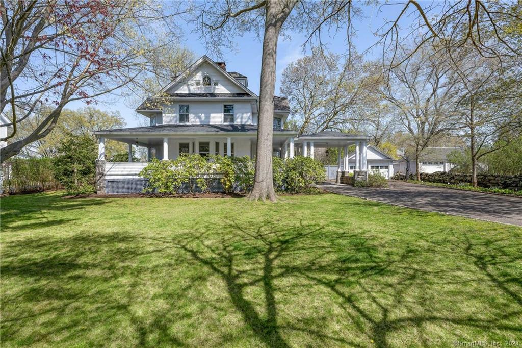 An Idyllic wrap around porch and porte cochere welcome  you to this gorgeous shore colonial south of the village of Old Greenwich.. A 4100 square foot home on nearly half acre of fenced in private yard, walking distance to village, beach and train. Grand scale elegant rooms with multiple fireplaces and high ceilings throughout define the house. A heated pool with spa off the rear deck make this the ultimate beach community residence. A unique and once in a lifetime opportunity to call it your own.