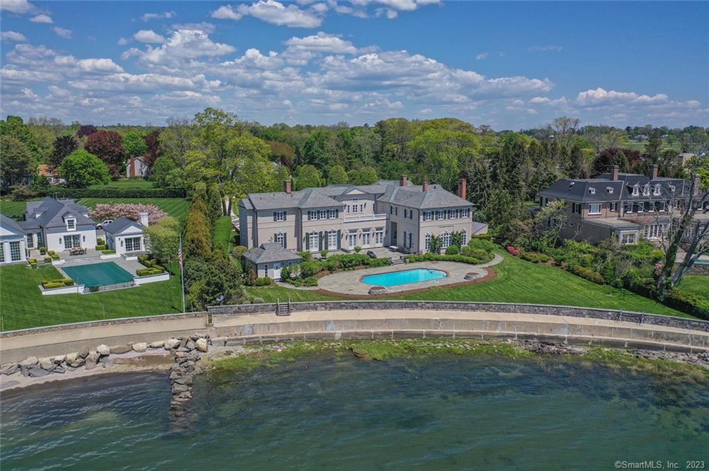 Spectacular builder's own custom waterfront home on private Rock Point Road off Pequot Avenue in historic Southport Village. Magnificent views of Long Island Sound from all major rooms in this 11,000+ square foot home. Beautiful pool and pool house look toward Beachside Avenue and the Manhattan skyline in the distance. Walk to the beach, train, restaurants, and shops. Waterfront living at it's very finest. 1 hour to NYC.