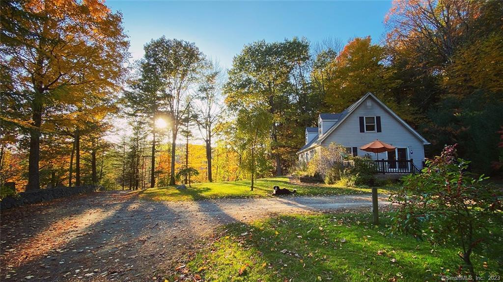 1989 Cape on 2.1 acres and also included in the sale is an adjacent 6.45 acre buildable lot with a 384 sf workshop/cabin with wood stove built in 2004. This lot has a lovely open meadow. The 1989 Cape has an open plan kitchen/dining area accessed from the open deck, a living room with a propane stove, 4 bedrooms - 2 of which are on the main floor and 2 full baths. The full basement has high ceilings and is suitable workspace. The house is set back from the road in a quiet setting with good light near Historic Grantville cemetery and across the town road to the west is a large protected wetland adjacent to land of Dennis Hill State Park.