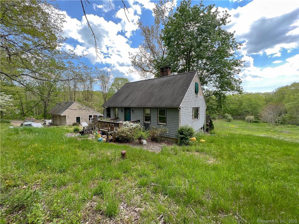 Introducing a hidden gem in the picturesque town of East Haddam, CT! This 3-bedroom, 2 full-bath home, built in 1978, offers a unique opportunity for those with a vision to transform it into their dream home. Nestled on just over 3 acres of open land, this property is brimming with potential. The home features an oversized detached 2-car garage, perfect for storing your vehicles, tools, or outdoor equipment. As you enter the home, you'll find a spacious open-concept kitchen and living room, with a cozy fireplace at the center - perfect for family gatherings or relaxing evenings in. The first-floor master bedroom comes complete with an ensuite bathroom for added convenience and privacy. The partially finished walk-out basement offers additional living space and features a laundry area on the lower level. With some TLC, this area could be transformed into a functional and inviting space for work, play, or relaxation. Please note that this property is being sold as-is and inspections are for informational purposes only. While it does require some clearing out and renovation, the potential to create a truly special home is evident. Don't miss the chance to bring your ideas and make this fixer-upper your very own. Schedule a showing today and start envisioning the possibilities at 143 Clark Hill Road, East Haddam, CT!