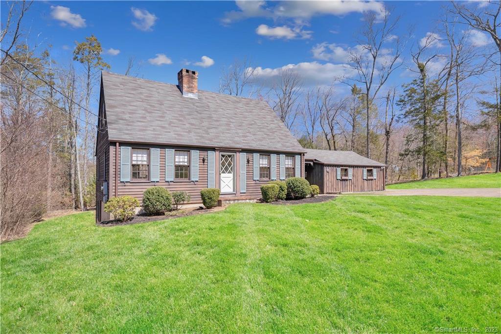 Quaint, 1535 sq. ft. Colonial located in quiet neighborhood in Somers. Situated on 0.92 acres, this home beautifully marries both traditional and contemporary creating an inviting space. The traditional front entrance gives way to a dazzling, refinished hardwood-floor Foyer and leads to a front-to-back, 3-sided Living room with plenty of windows, hardwood floors, raised-paneling, and a center-chimney fireplace. The Foyer also leads to the rear of the home where an over-sized Eat-in Kitchen awaits with post-n-beam ceiling, more hardwood floors, its own fireplace, and overhead space with skylight and an abundance of natural light. Off the Kitchen is a south-facing office with hardwood and a 1/2 bath. The upper level includes 3 hardwood bedrooms along with a full, nicely-appointed common bathroom. The lower level includes a finished recreational space with its own fireplace and walkout. The grounds are spacious, open and private. Other updates include: new garage doors, new dishwasher, new garbage disposal/faucet, new refrigerator, new stove, refinished hardwood floors throughout, freshly painted interior, new washer and dryer, new radon bubbler.