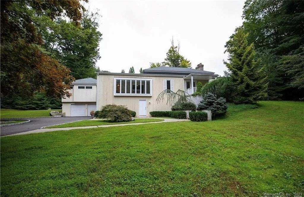 Located in the desirable Greenfield Hill Community, this expansive 4/5 bedroom, 4 bath residence is sure to impress.Situated on 2 acres of beautiful property, this mid-century contemporary home features a long circular driveway, 4 car garage, and a large deck perfect for entertaining. Inside you'll be surrounded by natural light and 9'+ ceilings that lend a feeling of grandeur throughout the main living area. The master suite includes a walk-in closet and en suite bathroom with dual vanities, while an in-law suite on the main level comes complete with full bath and kitchenette with private entrance. Spend time outdoors enjoying your 2 acre property featuring a picturesque pond - perfect for outdoor activities! With so much to offer, this home truly has it all. Riders Lane is known for having Block parties, Holiday walks, and a great book club!Schedule a showing today