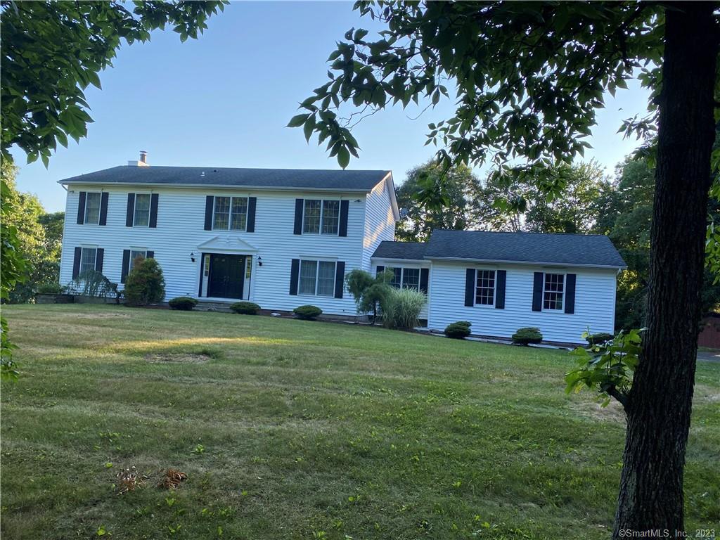 This, Custom Built by the original owner, 11 Room Center Hall Colonial, boasts 4 large Bdrms. and is on Danbury's great commuting West Side, (LOCATION, LOCATION, LOCATION!). Enter the Dramatic 2-story Entrance Foyer with a Marble Floor, and see French Doors to the Formal Dining Rm. and also French Doors to the Formal Living Rm. The large Eat-in Kitchen is open to the Family Rm. with Fireplace. Between the Kit. and the heated oversized 2-Car Garage is a Sunroom, (which can also be a full bath and laundry room). A 60X14 Deck runs the entire length of the house and can be accessed from the Family Rm. and the Sunroom, (great views). All Bathrooms have tile floors, the Main Bath & Master Bath have double sinks, linen closets, and Skylights. The HUGE Master Bathroom has a two person Whirlpool Tub and a separate walk-in Shower. The walk-out lower level is huge with an equipped Gym, Family Rm., Cedar Closet, and Unfinished Storage area. There four windows and French Doors to the rear yard. The home is built with 2X6 construction and includes: 11 rooms of freshly painted ceilings and walls, two separate Central Air Conditioning units, (each for Main and Upper Levels), Central Vacuum, Security System, generator ready sub-panel box, new exterior lighting, S/S Kit. Appliances, home built with two heating systems, (oil and electric), new well pump, interior fire sprinkler system, and the buyer chooses Master Bedroom flooring. New blacktop driveway near the garage and sidewalk is included.