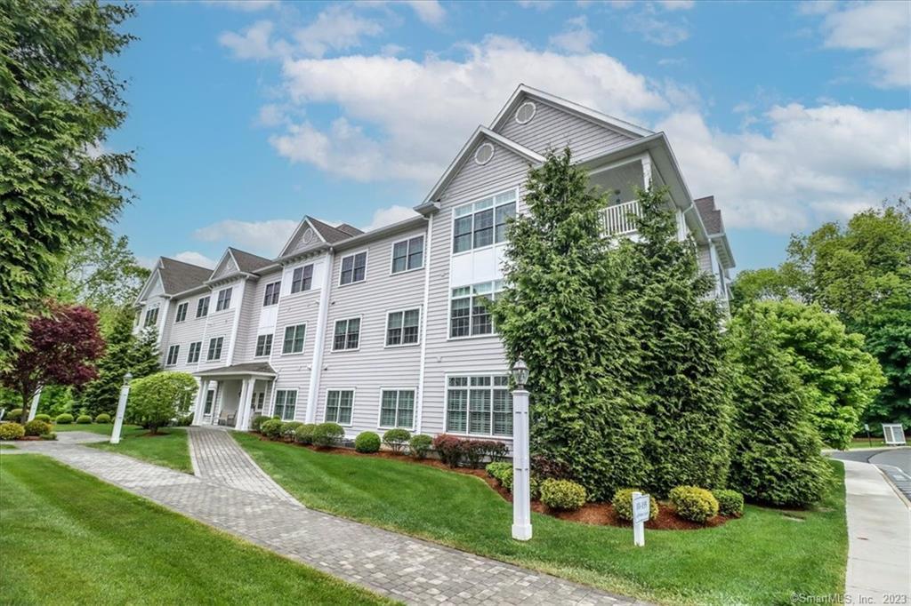 Beautiful main floor move in ready unit in the outstanding Newbury Village complex! Enter the secure building to unit 113 which is just steps from the elevator and main lobby. The 2 bedroom unit is very well maintained with a living/dining room combination and french doors that lead to the back deck, gally kitchen with a breakfast bar, granite counters, a large pantry and plenty of cabinet space. The master suite has loads of closet space, and a full bath with a walk-in shower. The second bedroom also has a walk in closet and is steps to another full bath and laundry room. Well designed one level living with nice privacy and sounds of the babbling brook from the deck. This 55+ community offers the lifestyle you desire including a clubhouse with kitchen, gym & shower rooms, inground heated pool, and underground garage parking & storage. Brookfield has been transformed into a wonderful town center with shopping, restaurants and walking trails!