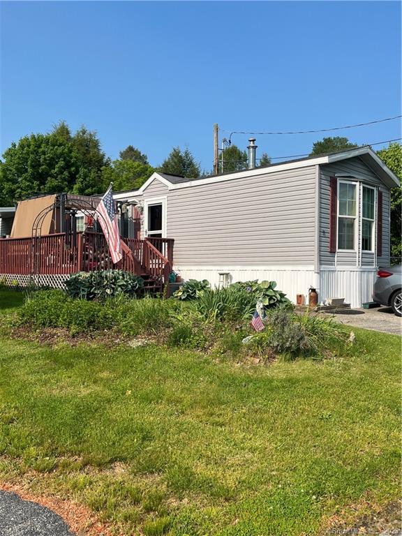 Welcome to lot 13! Walk up the stairs, sit on the porch and enjoy the peacefulness. This lot has a nice size yard & 2 sheds!Step inside and the living room has a vaulted ceiling, with a newer floor. The 1st bedroom has a nice bow window. The kitchen is of good size with plenty of cabinet space. The primary bedroom has a double closet and the bathroom has a walk in shower and a double sink.