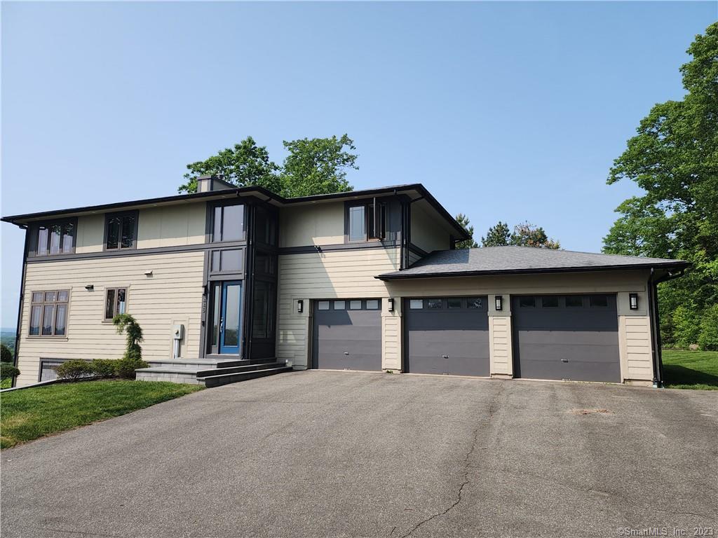 Welcome to a once in a lifetime find! This Modern Prairie style home was designed and built with inspirations from Frank Lloyd Wright. This beautiful four bedroom two full & two half bath home is one of a kind. The panoramic views of Southington Valley are exceptional and can only be found in this neighborhood. The open concept and oversized windows accentuate the breath-taking views throughout the house and allow an abundance of natural light. All the first and second floor maple millwork in the home was sourced directly from the property. The primary bedroom has a spa like en-suite bathroom including soaking tub, double rainfall showers, and a separate steam shower. In addition to the locally sourced millwork the home boasts Brazilian cherry hardwood floors, A Tulikivi soapstone wood burning stove imported from Finland, all brand-new Caf? appliances, industrial style range, new Unilock U-Cara hardscape design, Ipe wood deck, radiant heat in both full bathrooms, central vac, Surround sound system throughout, finished basement, wired for a projector/simulator and much more. Schedule your showing today and take advantage of this amazing property.