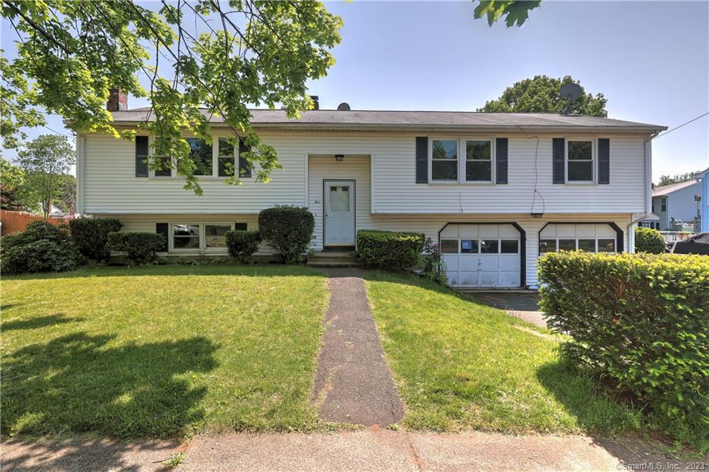 NOTE: Kitchen counter being replaced! This quiet neighborhood is the best kept secret in Hamden! All the beauty of Mt Carmel but minutes to Rt 15 and Rt 40 connector to I-95! The neighborhood has gorgeous views of Sleeping Giant and the street abuts all the farmland of the Ct Agricultural Experiment Station, with its fun community activities and you can be at the Hamden Library, shopping and restaurants in just minutes! Main level has a living room that opens to the dining room. Behind the dining room is a three season porch/sunroom that accesses the decks and fenced in backyard. The sunny kitchen has space for a table and the counter is being replaced. Down the hall are 4 bedrooms and the primary bedroom has a private, full bath. There is a second full bath on this level and hardwood throughout. On the lower level you will find a great spacious family room, a half bath and laundry, as well as access to the two car garage..Easy access to major highways, downtown New Haven and Yale. City water, city sewer. Responsible pet owners and long term leases welcome!