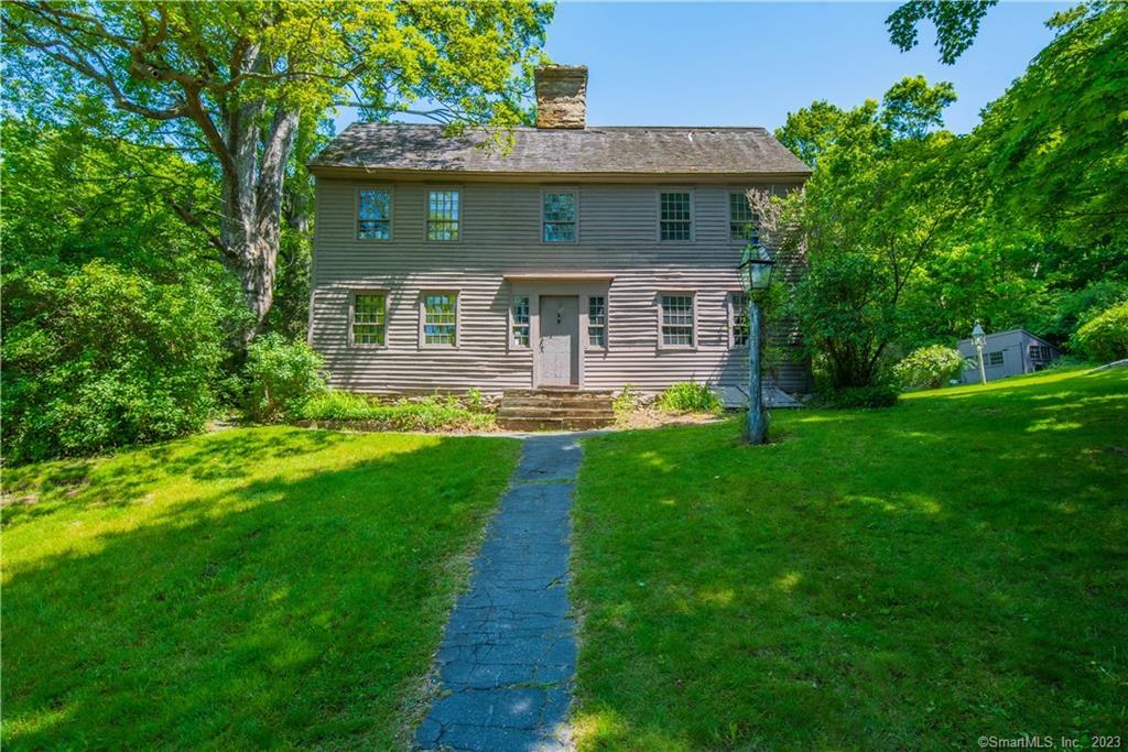 Built circa 1690 as one of the oldest homes in Woodbury. Beautifully sited it is a typical saltbox with plank walls, stone chimney, wide board floors, three large fireplaces with ovens at the back of two and much original wainscot. A new septic system is presently being installed. It seems to have been changed relatively little inside. The joiner's shop is still standing on the property with a one car garage underneath easily accessible. Adjacent to the large field sits an oversized barn with 3 stalls in the lower level and plenty of space on the first and second floors of this barn. In the back is a large wood shed with an attached outhouse plus a spacious dog house and run. Located minutes and within walking distance to the town center and coffee shops, gourmet restaurants, shopping, gardens and sidewalks. The New York Times in the Living In page referred to Woodbury as Peace, Quaint Beauty and a Sense of History and the Reader's Digest called it the best small town in Connecticut. Located only 1 1/2 hrs by car to NYC and 1/2 hr to the train station. Nearby is the community theater, LeRoy Anderson museum, historic Glebe House, concerts in the churches and parks, library, gyms, medical facilities and so much more.