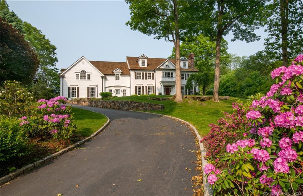 Relax and enjoy summer in New England! Experience country living in this rustic colonial overlooking a large and serene pond with access to a CANOE, a PADDLE BOAT and FISHING! The large chef's kitchen steps out onto a stunning stone patio making this home perfect for entertaining and casual everyday living. There are 4 finished floors. Work out in the 500 SF gym, play ping pong or spend a lazy afternoon reading in one of the cozy niches that many of the rooms provide. Or, canoe on the pond to unwind after a busy day! Enjoy the art galleries, the new New Canaan library, Grace Farms, Irwin Park, Waveny Park, shopping and restaurants just minutes away from this spectacular location. Join us for a wonderful and relaxing summer in the quaint town of New Canaan, CT!