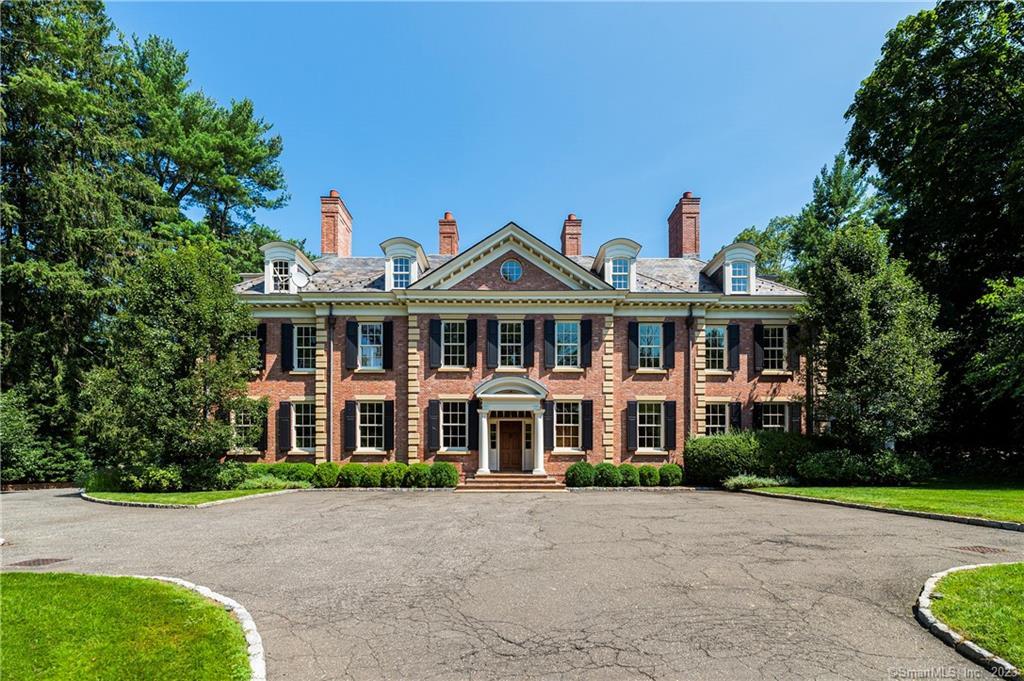 This sophisticated, mid-country, Georgian Colonial with gated driveway is set on 1.66 private and level acres conveniently located only minutes from Greenwich Avenue. The majestic front-to-back entrance opens to spacious rooms with 11' ceilings, 5 fireplaces, and impressive millwork and amenities throughout. The state-of-the-art lower level features a wine cellar, play room, media room, gym, and additional bedroom and bathroom with exterior access. The walk-out terrace with pergola and the veranda overlooking the beautiful mature landscaping and possible pool site offer the perfect spots for entertaining. Full house generator, indoor/outdoor surround system. 3-car garage plus parking court.