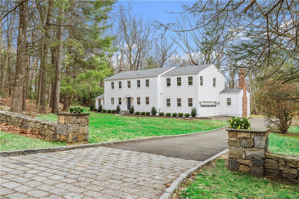 Tucked into the trees on a quiet cul-de-sac is the quintessential Connecticut colonial. This sun filled, fully renovated home boasts an ideal floor plan and sprawling, level property accented with mature trees and rambling stone walls with plenty of room for a pool Inside, the gleaming kitchen is stocked with new Viking appliances, ample storage, and quartz countertops. Fireplaces grace the large living and family rooms. A formal dining room and large, windowed office complete the first floor. Upstairs the primary suite, with large walk-in closet has a soaring tray ceiling and luxurious, brand new marble bath. Additionally, there are three spacious bedrooms, one with its' own bath. A large, sunny laundry room completes this level. The finished basement works perfectly as a gym or recreation space. The entire house has been fitted with new thermal paned windows and many of the mechanical systems have been updated or replaced. Move right in and enjoy the view.