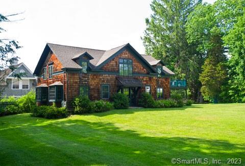 Pristine Arts & Crafts Carriage House. Perfect setting on Washington's Historic Green surrounded by the Frederick Gunn School and historic shingle-style Rossiter mansions. Ground floor ensuite primary bedroom, office with sleeper sofa and cozy den with wood-burning fireplace. Upstairs, king bedroom with ensuite bath, large living room, dining room and eat-in kitchen. Fabulous mahogany deck for barbequing. Wonderful walking or biking neighborhood near the Gunn Library & Museum, churches, a caf?, and the Steep Rock Land Preserve. Beautiful neighborhood views. Once in a generation opportunity to own a low-priced historic home on Washington Green. Must see!