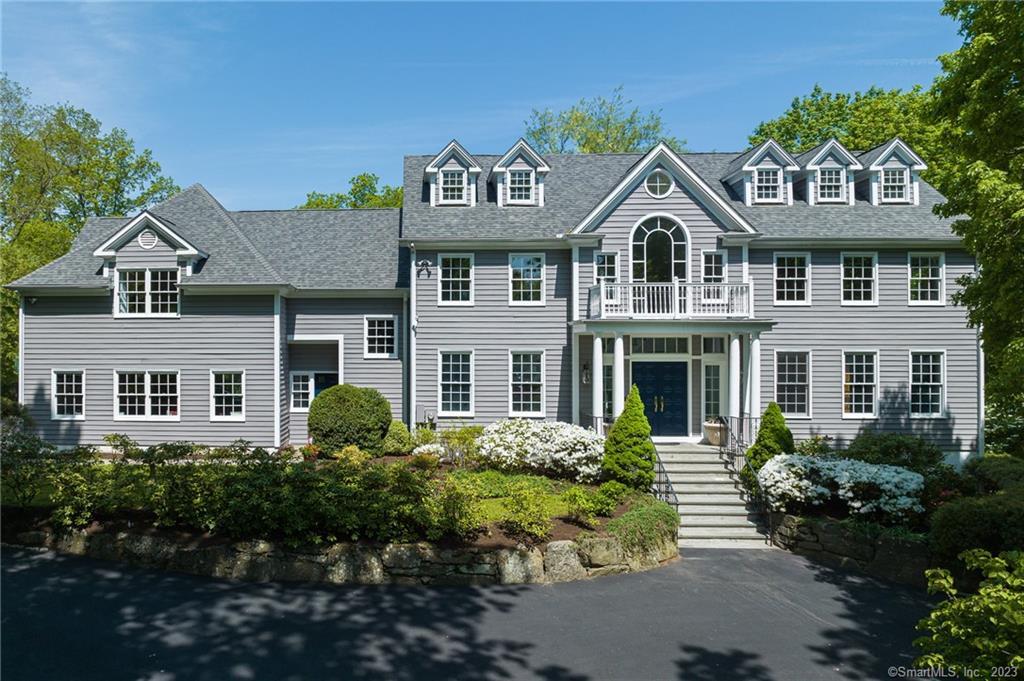 A gracious 5 bedroom secluded and light-filled colonial, with an expansive, flat yard surrounded by trees, off a quiet cul-de-sac in the highly desirable Bailiwick Association. Easy access to downtown Greenwich, schools, transportation, & amenities. Front entrance features a curving grand staircase from the marble floor up towards the soaring, double height ceiling. A beautiful cherry paneled office, living rm. dining rm. with architectural detail, granite-clad eat-in kitchen and adjacent family rm. with fireplace. Also features impressive solarium with the ceiling and 3 sides all dressed in glass. Upstairs is a luxury master suite including a sauna, 3 bedrooms, & an oversized in-law suite w/ kitchenette, large living rm., bedroom & bath. Professional landscaping, terrace and 3 car garage. Agent/Owner.