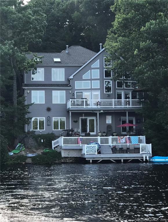 TRANQUILITY BY THE LAKE! COME LIVE YOUR DREAM! Spectacular 5009 sqft custom designed home, built in 2002 by Owner on Private Lake Bungee w/ 105' of waterfront & Private Beach on 111acre lake.Stunning views from every room.Lakeside, 4 lge decks & boat dock.Abundant natural light overflows thru the 21' cathedral ceiling windows.Large LRm window seat invites you.Grand open floor plan, NEW A/C & HEAT SYSTEM on all three levels. Formal Dining room. CHERRY kitchen w/GRANITE counters, center island seating & dining space. Floor to ceiling Cherry pantry.Magnificent MST Bed/Rm suite includes fireplace, skylights, 11'cathedral ceiling, walk in closet7'X14' & ample sitting room.Adjacent Balcony can be used for office, library/sitting/rm w/captivating lake views.Elegent tile bath rm w/skylight, whirlpool tub, palladian window & 4'enclosed shower.Two more generously sized bedrms w/adjacent full baths.There are 4 propane FPs in the living rm, den & two bedrooms.Billiard & game room w/ skylight & Palladian window. Open French doors to your private accommodations, full tiled bath, 3 sided fireplace w/ custom bookcase in the great room w/ wet Bar &walk-out to Lake.Medallion ceiling accents grace the light fixtures through-out.Laundry rm is on the Main floor w/oak cabinets & utility sink. Numerous Ammenities list available.Enjoy all water & winter activities right OUTSIDE YOUR DOOR!! Oversized attached 2 car garage.Low maintenance yard w/perennial plants. DREAMS COME TRUE!! EVERY DAY A VACATION !