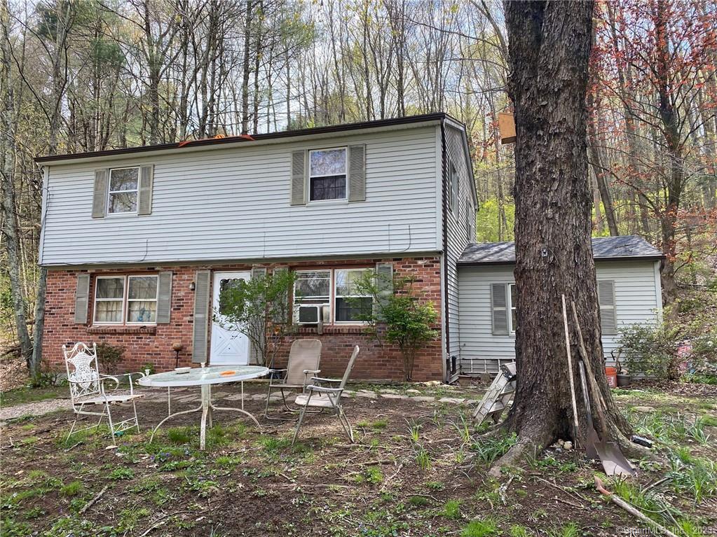 Private Colonial on 9 plus wooded acres located close to the town center, schools, shopping, sidewalks, library and medical offices. Built in 1966 it is a wonderful home with a 2 car garage. The roof was replaced in 2021. Septic was pumped in 2022. Located in historic Woodbury recently called by the Reader's Digest Best Small Town in Connecticut.