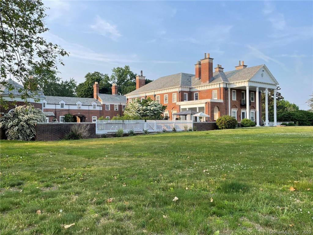 Experience the timelessness of The Chimneys, an architectural gem designed by the legendary Charles Wellington Walker in 1928. Originally built with the finest materials, this Georgian Revival style home garnered the prestigious America's Finest Home Award in 2015, acknowledging the attention to detail that has gone into its restoration. A 54-foot front-to-back Grand Hall, centered by a sweeping staircase with unique hand-wrought iron balustrades, exudes a sense of elegance. The 11 fireplaces, each a work of art, adorn the rooms with distinct style, adding warmth and character. The main floor includes a front-to-back living room with twin fireplaces, billiard room, library, formal dining room, office, and a kitchen/family room combination. Two extra rooms could become an in-law suite w. separate entrance and full bath. On the 2nd floor, the primary suite beckons with a full bathroom, dressing room with a fireplace and terrace, and a Juliette balcony, offering views of Long Island Sound. Five of the bedrooms on the 2nd level are ensuite, and boast their own fireplaces. In total, there are 11 BR, 7 full BA, and 3 partial BA. Adjacent to the 6-car garage, a townhouse-style carriage house provides a guest area. The two-story columned porch on the side invites you to the in-ground pool and cabana, complete with statuary. There is a full-length stone patio in the rear, overlooking the fountain and perennial gardens. Land may be subdividable, due to .20 acre zoning.