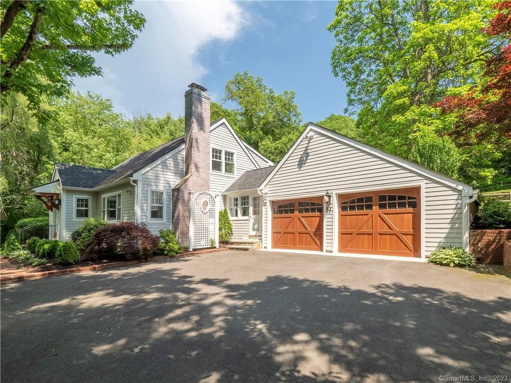 Lovingly renovated and well cared for Cape tucked away on a secluded 1 acre lot surrounded by mature trees and perennial gardens with a beautifully sited, heated in-ground pool. Just 1/2 mile from the shops and restaurants in Georgetown, one of Wilton's most sought after and quintessential neighborhoods. This 3 bedroom, 2 ? bath home is loaded with all the charm and character of a 1940's cape yet adorned with modern amenities and all the storage space you could ever need! Walk through the sliders from the updated kitchen to your private outdoor oasis with a spacious patio, professionally landscaped yard, an in-ground heated pool and new outdoor speakers with Bluetooth receiver. A living room with a wood burning fireplace, a dining room with built-ins, a bedroom with built-in desk space and updated full bathroom complete the first level. The second level has an oversized main bedroom, tons of closet/storage space and en suite bathroom. Finishing off the 2nd level is a second large sun-filled bedroom with two closets and access to additional storage space. The basement has been fully renovated with a wet bar, ? bath and new oversized washer and dryer. The improvements on this home are too many to mention and include a new roof in GAF architectural shingles, James Hardie plank siding, new central air, newly insulated garage and doors with epoxy floor, new water filtration system and water well pump. This home is a must see and move-in ready!!