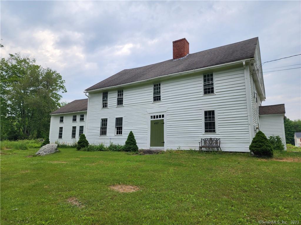 Welcome to the historic Benjamin Coit House at 457 Roode Rd, Griswold, CT. This magnificent property features 2 NEW Propane Furnaces, all new updated plumbing, new hot water heaters, and a 1-year-old well. The main house showcases wide-board flooring, a grand central chimney with SIX fireplaces including a cook fireplace in the spacious kitchen. With over 5 bedrooms, and 3 full bathrooms, this home offers flexible living arrangements. The adjoining unit includes a kitchen, living room, office, full bath, sitting room and more. Don't miss the large 3-car garage with a workshop and the little bonus building. Embrace the opportunity to own a piece of history and continue the restoration of this remarkable property.