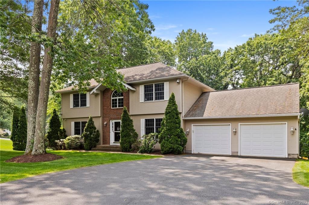 Exceptional custom built colonial home with 4 beds, 3 full baths, 1 half bath, and 3400+ total sq ft of living space situated in a private cul-de-sac within a highly sought after South Windsor neighborhood. Open, bright, inviting, yet VERSATILE floor plan ideal for MULTI-GENERATIONAL LIVING. Stately 2 story entrance foyer flanked by formal living and dining rooms, both with hardwood flooring. Eat-in tiled kitchen with granite counters and stainless steel appliances opens to spacious first-floor family room with fireplace. First-floor laundry and half bath. Second floor includes master suite with walk-in closet and full bath. 3 additional bedrooms and a second full bath complete the upper level. 900 finished sq ft (incl. in total) on walkout lower level with multiple rooms, full bath with whirlpool tub, and wet bar kitchenette could be a potential in-law space. Large deck with hot tub overlooks private backyard with manicured grounds. Updated oil boiler, updated hot water heater, and updated central air system (all 2020 or newer). Irrigation system, c/vac system, whole house standby generator and security system. Tons of storage including Gladiator storage system in garage. Located in the desirable PR SMITH ELEMENTARY SCHOOL district. Extremely tranquil, park-like setting yet very convenient to Evergreen Walk, Buckland Mall, Costco, Whole Foods, and easy access to I-84 for easy commutes.