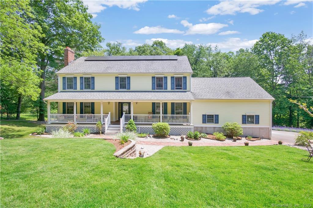 Nestled on a private 2.64 acre lot in the desirable Paradise Avenue area is this amazing custom built home waiting for its new owner. This is not your typical cookie cutter colonial. Well maintained one owner home belongs to a master cabinet maker and you will find one of a kind details throughout every level. The rich thick woodwork trims all the windows and doors, the kitchen has quality custom built cabinets. Let's begin with the welcoming front porch a perfect place to relax. The foyer is large and anchored by the turned staircase and flanked with french doors leading to the living room and the dining room. The family room has a built in bookcase and a bay window that overlooks the lovely back yard. The custom kitchen has an island with a Mahagony countertop, granite counters, SS appliances, and an eating area with slider to the 54' long trex deck providing a perfect outdoor entertaining area. Upstairs there are four huge bedrooms and a third floor with a finished space which makes a perfect home office, guest, or au pair space. The huge basement with a steel beam is wide open with only one lolly column, so you can utilize every inch! An additional basement area walks out to the back yard. It's a must see! You will only be limited by your imagination as to what you will do with this space. Solar panels make this home energy efficient. Convenient to shopping, schools, Quinnipiac University, and easy access to New Haven, Yale, hospitals, and trains.