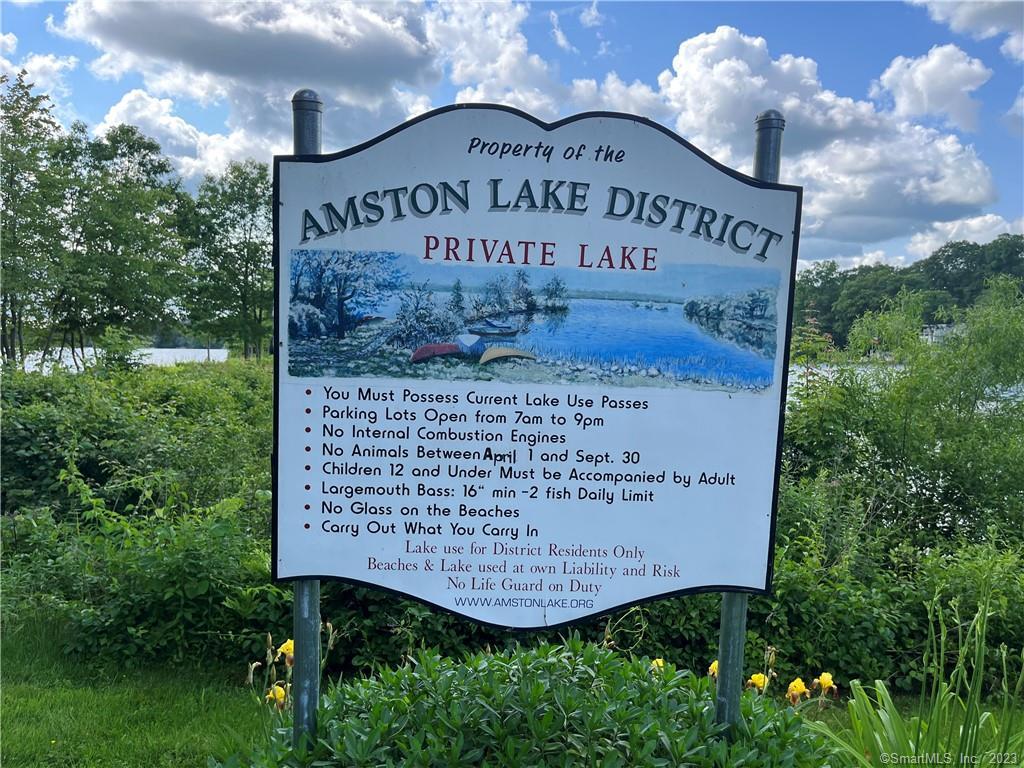 First let me tell you about Amston Lake. You have never been there because its private! Check out Google reviews and you will see how much the residents love their lake (ok, so there was one 1 star review from someone who hated it was private). There are seven right of ways on the lake and 2 beaches including the famous Lollipop beach. 2 dock areas in which a slip can be had through an annual lottery, but don't worry, there are boat racks for your canoes and kayaks available. This is a quiet extremely clean lake where only trolling motors up to 5 hp are allowed. Fishing? Of course-Largemouth bass, chain pickerel, black crappies and a host of pan fish-but remember, you can only fish here if you own property here. Events? Yup-there is Tiki night, Chocolate Bingo, July 4th parade, movie nights, Oktoberfest and much more!Not ready to build? Buy the property and build later. This is one of the largest lots in the association and is grandfathered in for zoning with city water and sewer available. You can still enjoy the private association while waiting to build. If you are ready to build we are working on a building package. Perc tests are still required even with sewers, but they are done. Enjoy the private lake life! Check out the website at http://www.amstonlake.org/ .