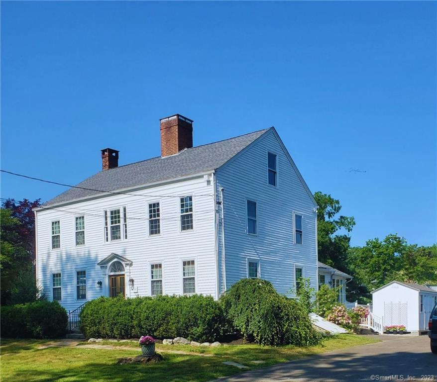 Newly updated historic farmhouse built in 1804 located moments away from the town green, shopping and Jacob's Beach. Home has 4, 700 SF of living space which includes 16 rooms, 5 bedrooms, 4 full baths, 5 fireplaces, 3 staircases, 3 decks and 2 kitchens on three levels. A few lovely features include the solarium which has a babbling koi pond adjacent to a spacious family room & 2nd kitchen for entertaining as well as a home office with separate entrance. Farmhouse also boasts wide plank pine floors, exposed antique wooden beams, interior stone floor/wall, a butler's pantry, 2 laundry rooms and an attached cottage that would make a wonderful in-law apartment. **Current owners use the attached space as an Airbnb, which will only be viewed on 2nd showing. Newer roof (2016), windows and updated plumbing & electrical/fixtures throughout.This property borders West River Condominiums and shares their septic, for a small monthly fee. Current owner pays a monthly fee of $231 which includes septic, trash and use of pool. However the new owner may choose to reduce the monthly fee if they do not want to use the trash or pool.