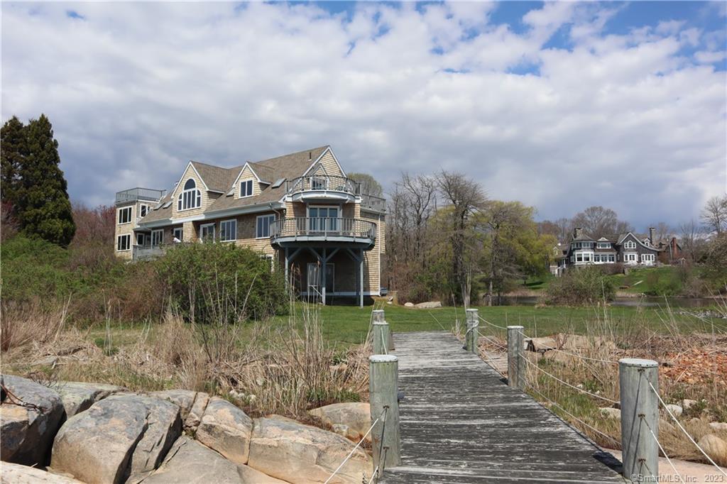 Gorgeous direct waterfront! Expansive views of Long Island Sound and the Atlantic Ocean from almost every room. This year round rental is stunning! The fabulous architect designed custom shingle style home has over 5, 000 sqft of living area. 12 rooms, 3 bedrooms (with other available space for overnight quests) and 4 1/2 baths. Features include a spectacular Living Room with fireplace, dining area, and lovely kitchen,  1st floor bedroom, enclosed porch, deck and central air. A beautiful primary bedroom suite with private porch and amazing views is located on the second floor. A wonderful second bedroom also with view, porch, deck and bath is on this level. This extraordinary home has 3 levels, easily accessible from the home's elevator. The walkout lower level is very spacious, and is ideal for a recreation, game room, family room or office. There is also a full bath on this level. The lovely long driveway leads to this wonderfully private 4 Acre setting overlooking Fishers Island, Plum Island and Long Island. The property is located near Harkness Memorial State Park and Eugene O'Neil Theater. This magnificent private home, with direct waterfront and gorgeous views makes living a year round vacation!