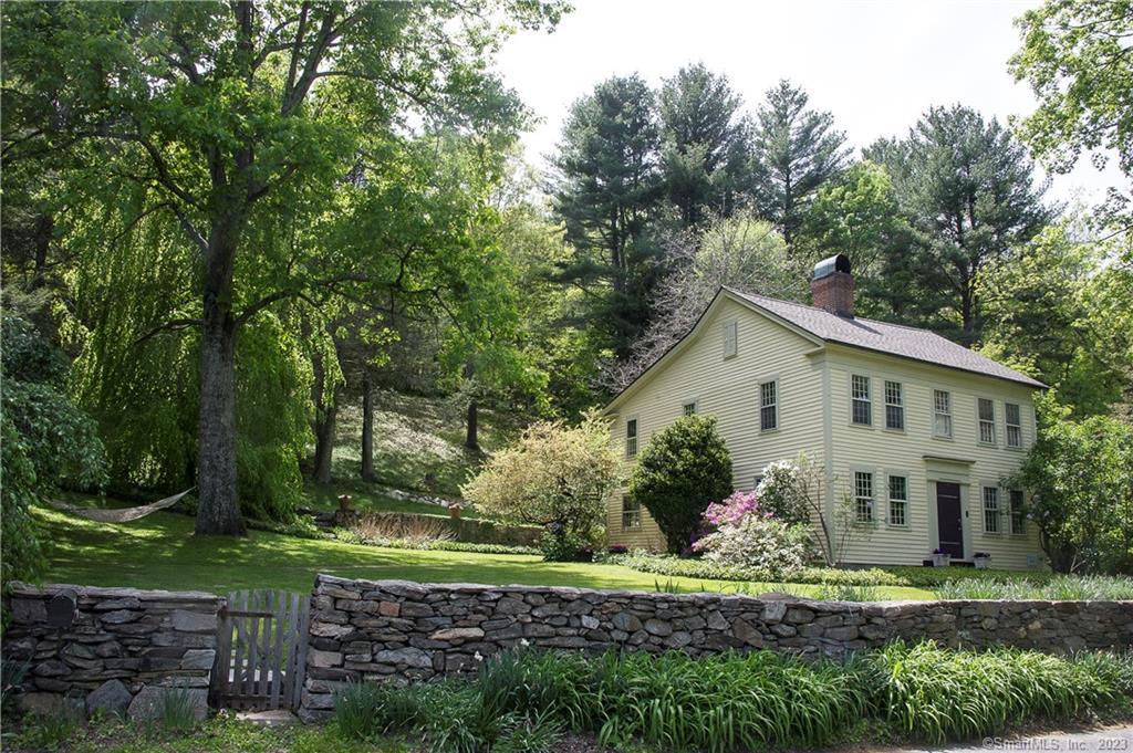 Calling all artists and antique lovers! This is a one of a kind property with an antique home and a barn workshop. The 2.8 acre parcel has the historic 1805 Antique home which was the house of the original toll keeper for the Washington-Woodbury Turnpike (now Rte 47). There are 2 bedrooms but the house can function as a 3 BR with 3 working fireplaces and gorgeous gleaming wide board chestnut floors. The house has been very well maintained with a newer heating system, well tank & oil tanks. There is radiant heat on the main floor & a walkup attic. The home retains all of the antique character and charm it was built with. The house has an eat in kitchen adjacent to the living room with wbfpl. Also adjacent to the LR is a den with a wood stove, and the dining room with the original antique kitchen cooking fireplace. Upstairs are two bedrooms, a full bathroom and a large additional room used as an office and laundry, which could easily be converted into a master BR suite.