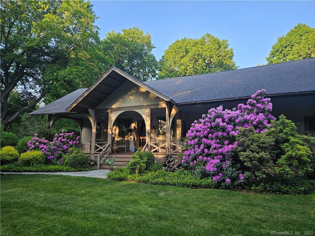 One of the earliest known surviving examples of Craftsman architecture in Redding, this rambling 1906 ARTS&CRAFTS home, w/a 2003, 2,000 sf addition to the period, sits on 7+ private ,level acres. English cottage style diamond paned windows, hand-cut mission woodwork, board & batten wainscoting, irregular rooflines, overhanging eaves and a 72' front porch. 4 original floor-to-ceiling fieldstone fireplaces in the spacious living, dining and music room,  cozy library w/built-in bookshelves. Large ,sunny country kitchen w/white leaded glass front cabinets, island, limestone counters, stainless appliances, adjacent butler's pantry and milled antique barn wood floor. Oversized main floor primary bedroom suite w/french doors to patio overlooking back property and Brazilian cherry floor, travertine marble in bath, dressing area & 2 walk-in closets. 2 staircases to add'l bedrooms plus a playroom/office and 38' wood paneled game room. Outbuildings include a detached 2-car garage and workshop w/1 bedroom apartment above, well house, garden shed, bunk house. Charming original raised stone patio, stone walls, specimen & fruit trees, perennial gardens including iris and peony, fenced vegetable garden w/raised beds & multiple pool sites. Possible horse property. Walk to Lonetown Marsh for birdwatching & winter ice skating and concerts on the green at Town Center. This enchanting, peaceful country retreat is minutes from trains, shops, restaurants and only 60 miles from NYC.